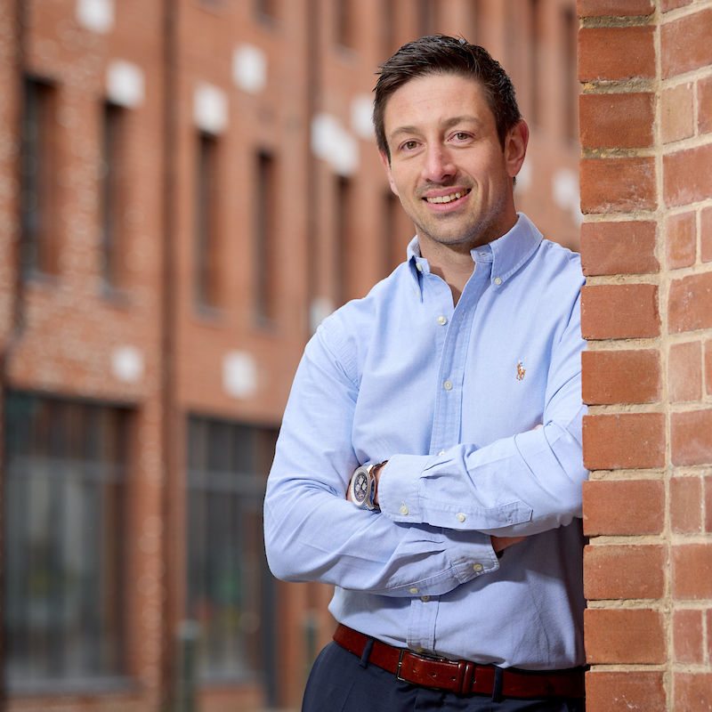 Dean Leaning Against a Wall